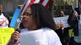 Dozens march to Flint city hall as the water crisis turns 10 year old