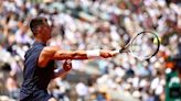 Tennis-Alcaraz mauls Wolf to reach French Open second round