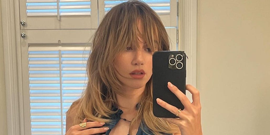 Suki Waterhouse gives rock and roll realness in a fuzzy coat and red lacy lingerie