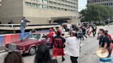 Driver confronted after car driven through protest against police in Winnipeg