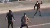 Moment youths wielding MACHETES fight outside Southend theme park
