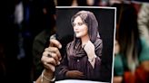 Iran Protests Draw Thousands in Milestone Memorial for Amini