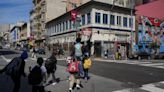 With a vest and a voice, helpers escort kids through San Francisco’s broken Tenderloin streets