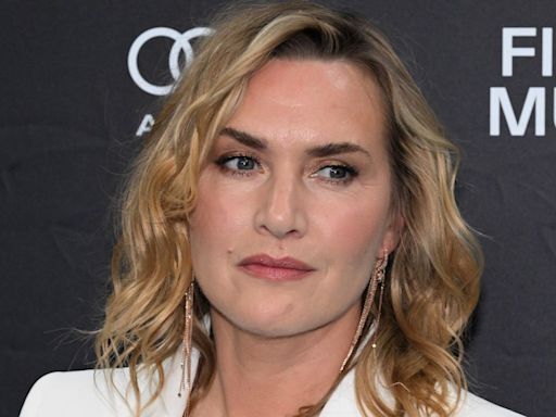 Kate Winslet is a vision in fitted bridal white suit