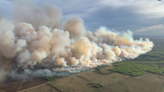 Canada’s wildfire season re-erupts forcing thousands from homes, prompting air quality alerts in northern US