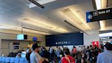 Dozens of Delta passengers have been stranded at the Atlanta airport for more than 24 hours, as airlines struggle to overcome mounting cancellations and delays