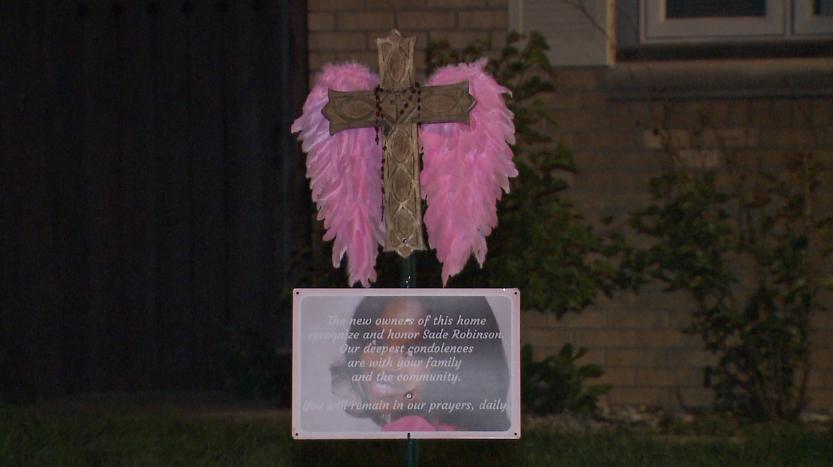 New owners of murder suspect's home place memorial for victim