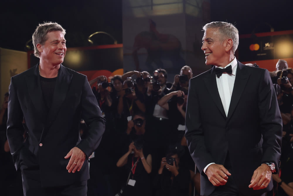 Brad Pitt and George Clooney Dance to 4-Minute Standing Ovation for ‘Wolfs’ During Chaotic Venice Premiere