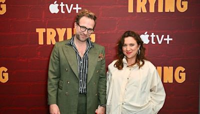 Rafe Spall kisses girlfriend and co-star as she proudly cradles pregnancy bump