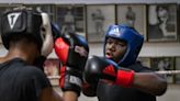 'Batman and Superman' teach more than boxing at Christamore House