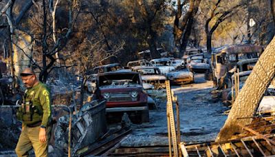 'Moonscape': Airport fire evacuees wait, and hope the blaze spares them