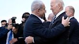 Israel Prime Minister Benjamin Netanyahu greets US President Joe Biden upon his arrival at Tel Aviv's Ben...