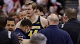 Wisconsin basketball team isn't focused on last year's fight with Michigan, but star Wolverine Hunter Dickinson calls Badgers 'scumbags'