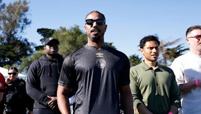 Hollywood star Michael B. Jordan poses with Dominic Solanke jersey