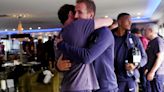 Gareth Southgate and his England players embrace following Euros loss