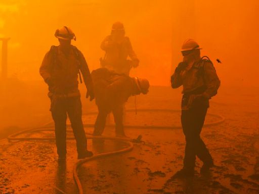 Fires besiege Southern California mountain communities; homes burn, 13 hurt