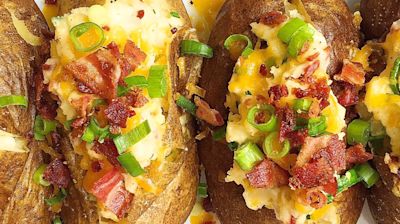 Give The Basic Baked Potato An Upgrade With These Cheesy Loaded Baked Potatoes