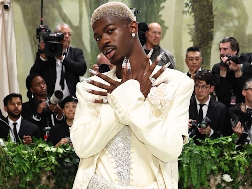 Lil Nas X Rocks Sparkly Suit, Blond Hair and Extra-Long Acrylic Nails for 2024 Met Gala