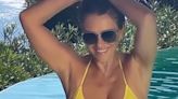 Elizabeth Hurley Sizzles in a Bright Yellow Bikini in Vacation Flashback Video