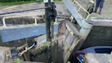 Boat stuck in canal lock as damaged gates collapse