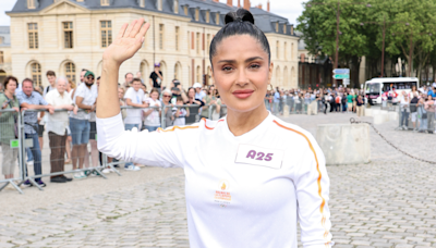 Salma Hayek wears a luxe white tracksuit to carry the Olympic torch