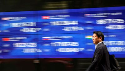 Asia stocks hit 27-month top, dollar slips on rate cut talk