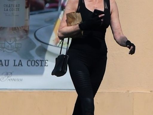 Melanie Griffith displays her fit figure in fitted tank top