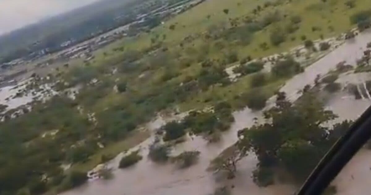 Desperate search begins to find tourists trapped in floodwaters