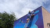 Artist paints razorback sucker mural at Moab Information Center - The Times-Independent