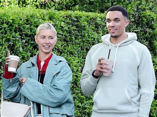 Pictured: England star Trent Alexander-Arnold is seen with Jude Law's Christian Dior model daughter Iris - as the couple enjoy a stroll along Notting Hill's trendy Portobello Road
