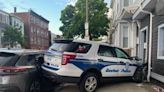 Boston police cruiser struck a building while responding to call for a man with gun