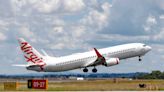 Woman dies after collapsing on Virgin Australia flight in front of horrified passengers