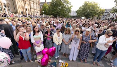 Tributes paid to girls who died in Southport attack as hundreds attend vigil