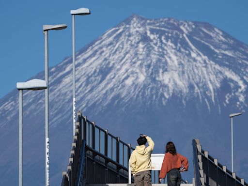 Second Japan town blocks view of Mount Fuji in battle with problem tourists