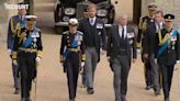 Prince Harry marches in Queen Elizabeth II’s funeral procession toward St. George’s Chapel.