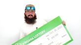 Man celebrates with his dogs after winning $500,000 from Virginia Lottery scratch-off