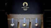 Piece of Eiffel Tower in medals? Gold medals not solid gold? Olympic medals deep dive