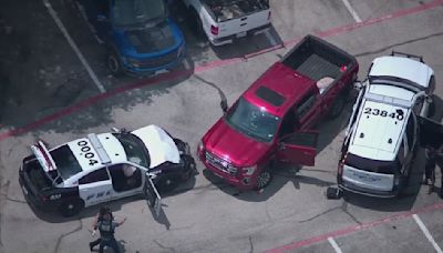 Dallas police shoot armed suspect after stolen truck rams cruisers; another suspect on the run