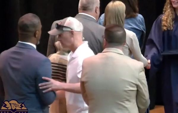 Video of man pushing Black superintendent at daughter's graduation sparks racism claims
