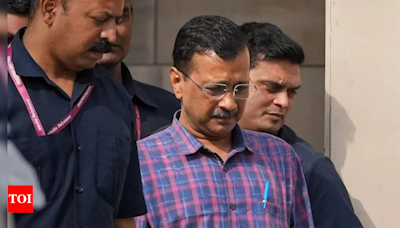 BJP accuses Arvind Kejriwal of involvement in liquor scam, calls for resignation | Delhi News - Times of India