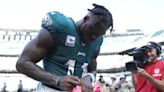 Why does Philadelphia Eagles player AJ Brown wear pink shoes?