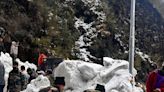 Army personnel clear snow after avalanche sweeps away group of tourists in the Himalayas