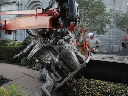 A vandal badly damaged a statue outside a St. Louis cathedral, police say