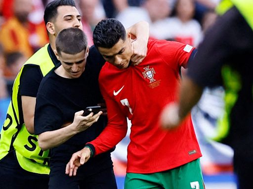 Roberto Martinez questions Uefa security after Cristiano Ronaldo approached by six pitch invaders