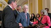 Mitch McConnell escorted away from cameras after freezing mid-news conference