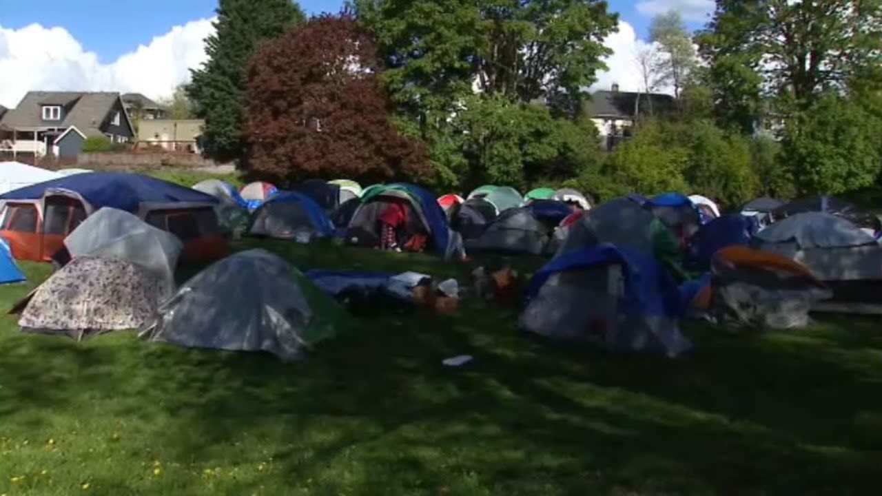 Hundreds of asylum seekers in encampment at Seattle park after funding for hotel stay runs out