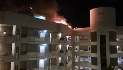 Horror as helicopter crashes into top of hotel sparking mass evacuation