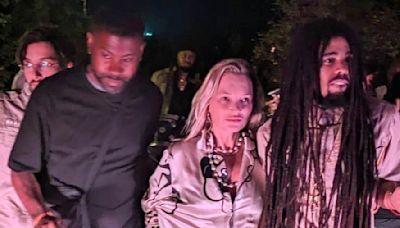 Kate Moss, 50, is pictured holding hands with Bob Marley's grandson