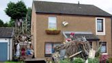 Son can't sell mum's home due to neighbour's 'art monstrosity' in front garden