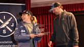 Shiffrin named 'skier of the year' for the 3rd time. She receives the trophy from Bode Miller